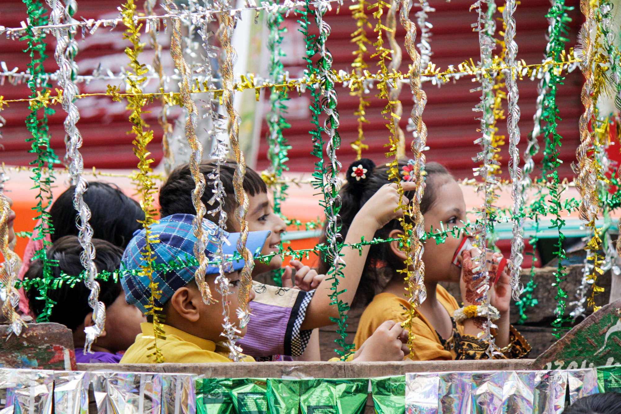 kids seated in decorated trolley